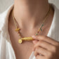 Wealth Blessing – Golden Dzi Bead & Yellow Jambhala Braided Necklace