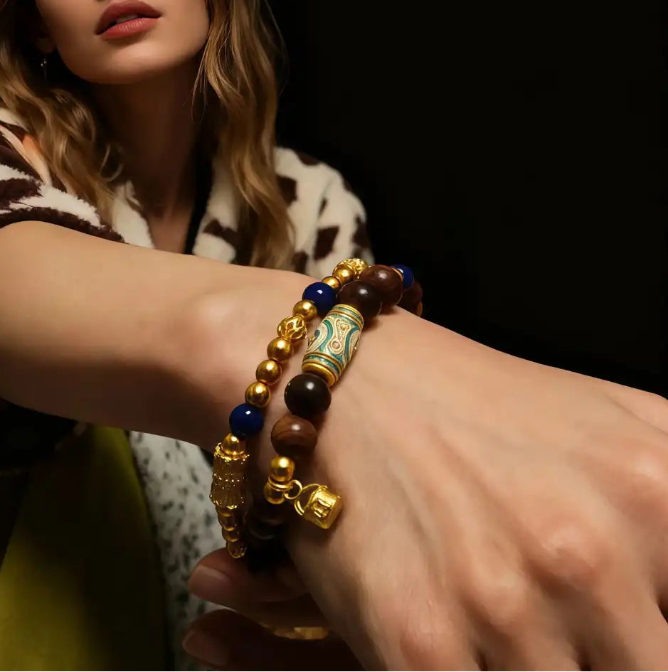 Gold flow agarwood bracelet with Dzi charm worn on wrist, showing fit and style