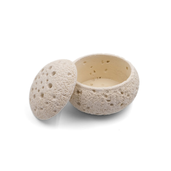 Balance & Clarity Feng Shui Lunar Incense Burner, light-colored round incense holder with porous moon-like texture and partially open lid showing interior, spiritual decor for meditation on a clean white background.