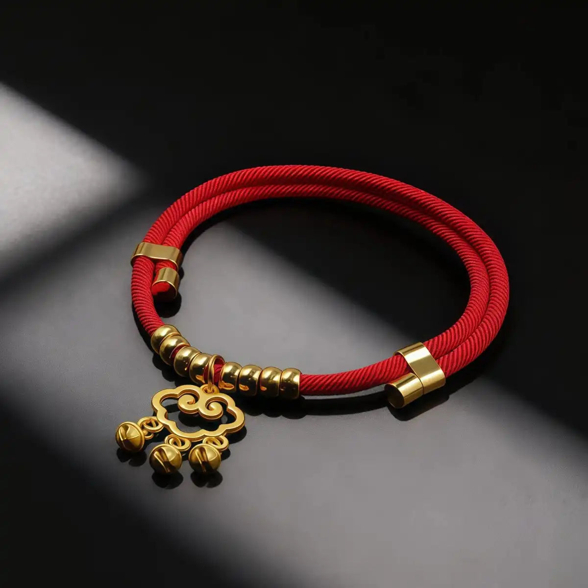 Pet collar with a gold-tone auspicious cloud charm displayed on a clean background, showing its sleek red band and symbolic cloud pendant design.