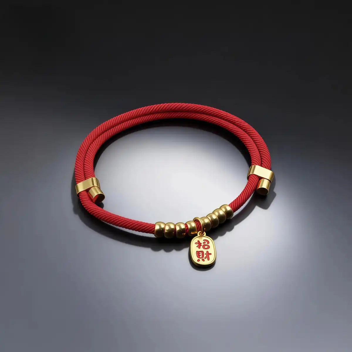 Red pet collar with a gold-tone prosperity charm displayed on a clean background, showing the simple band and detailed wealth symbol pendant.