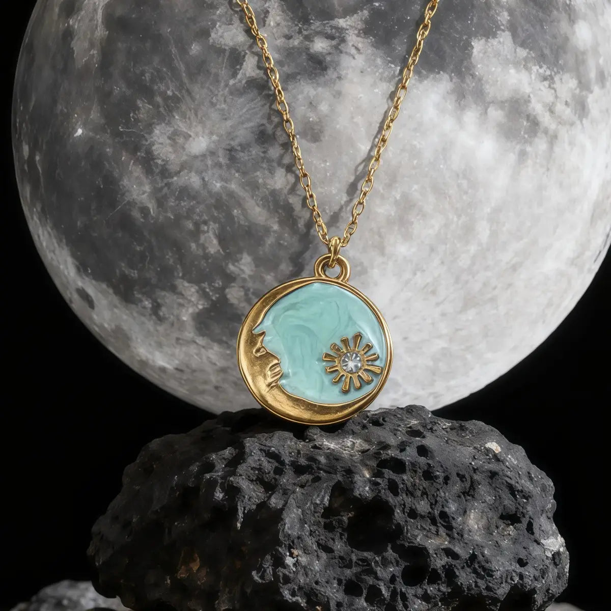 Necklace with a pendant in front of a moonlit rock