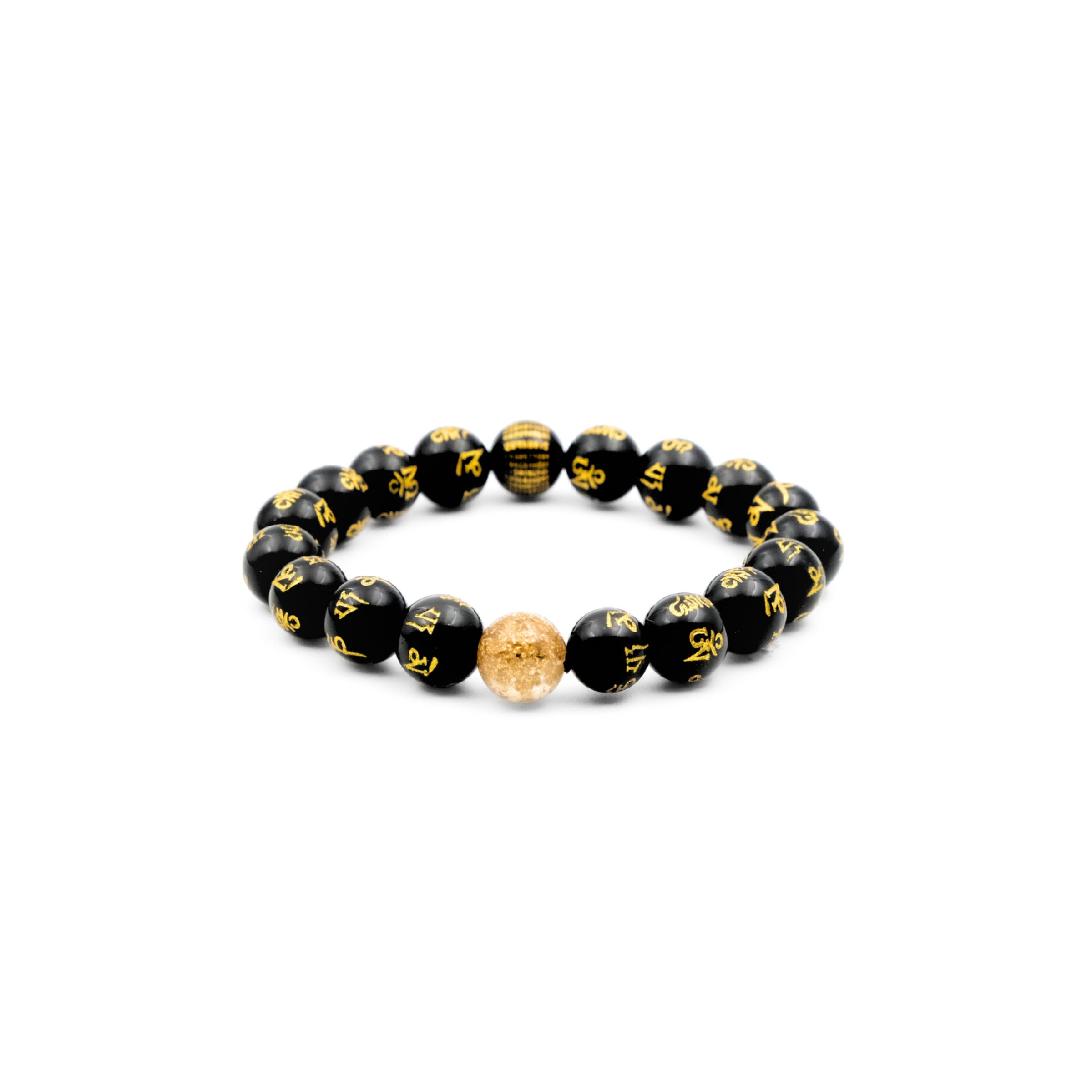 A Buddhist Mantra Bracelet made up of black obsidian beads, each inscribed with the golden Six - Word Mantra. A single golden - hued bead stands out among the black ones. This bracelet is symbolically believed to offer protection and help balance energy, combining spiritual significance with a simple yet striking aesthetic. 
