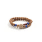 A Buddhist Prayer Bracelet, composed of two strands of wooden beads. Interspersed among the wooden beads are vibrant blue beads and a couple of darker - colored beads. At the center of the bracelet, there's a unique, carved bead resembling a flower.