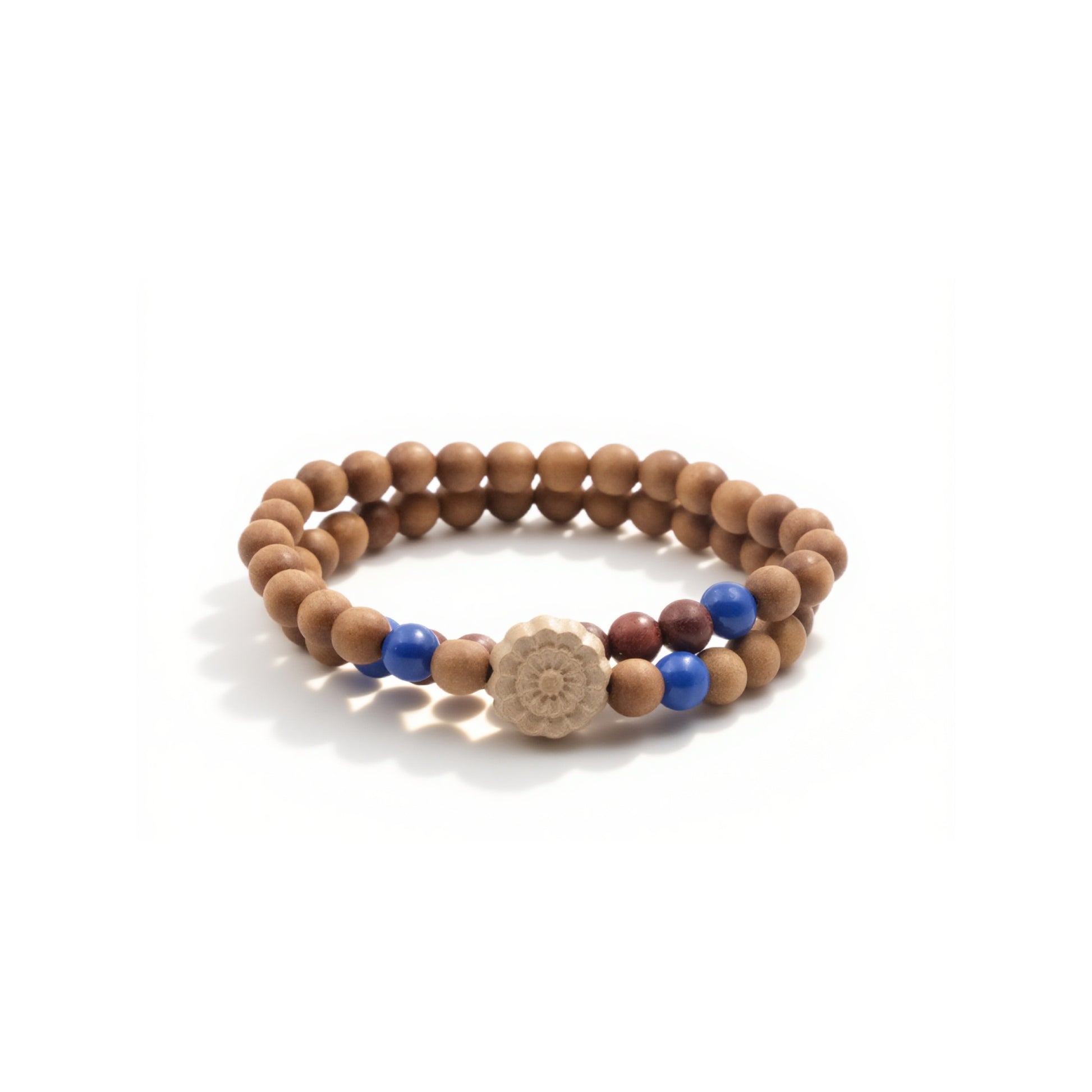 A Buddhist Prayer Bracelet, composed of two strands of wooden beads. Interspersed among the wooden beads are vibrant blue beads and a couple of darker - colored beads. At the center of the bracelet, there's a unique, carved bead resembling a flower.