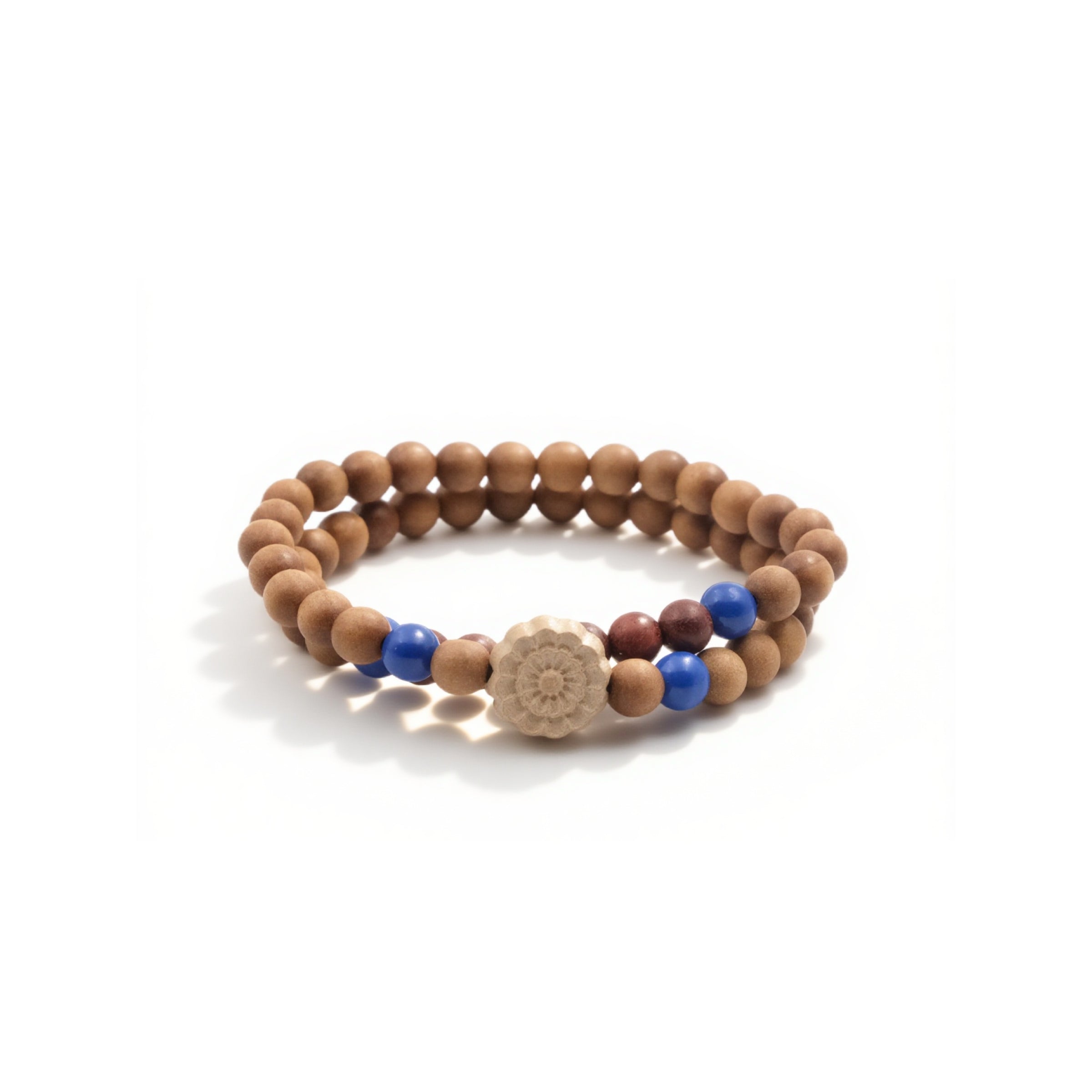 A Buddhist Prayer Bracelet, composed of two strands of wooden beads. Interspersed among the wooden beads are vibrant blue beads and a couple of darker - colored beads. At the center of the bracelet, there's a unique, carved bead resembling a flower.