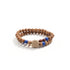 A Buddhist Prayer Bracelet, composed of two strands of wooden beads. Interspersed among the wooden beads are vibrant blue beads and a couple of darker - colored beads. At the center of the bracelet, there&