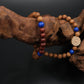 Buddhist Prayer Beaded bracelet with blue and red beads on a dark background
