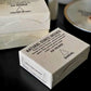 Box of sandalwood incense cones on a dark surface with a blurred background