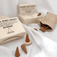 Incense cones and packaging on a white fabric background