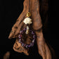 Amethyst bracelet and white flower charm on a dark background,Feng Shui Keychain & Phone Pendant – Mini Prayer Wheel with Amethyst Phantom & Bodhi Root for Mindfulness & Protection