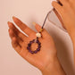 Hand holding a small purple beaded object against a plain background, Feng Shui Keychain & Phone Pendant
