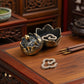 Feng Shui Lotus Incense Burner in bronze lotus design, displayed with open lid and incense chips placed inside, symbolizing energy clearing, balance, and inner peace.