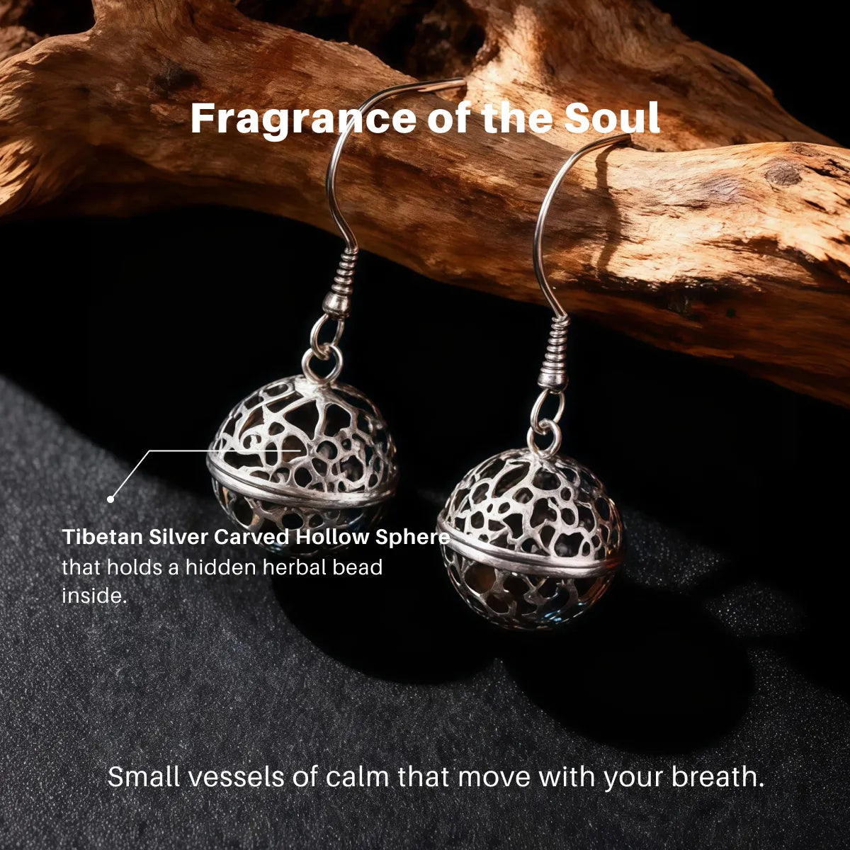 Silver earrings with carved hollow spheres on a dark surface with text describing their features.