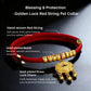 Image with labeled details of the red collar band, gold longevity lock charm, and the symbol’s meaning of protection, blessings, and good fortune.