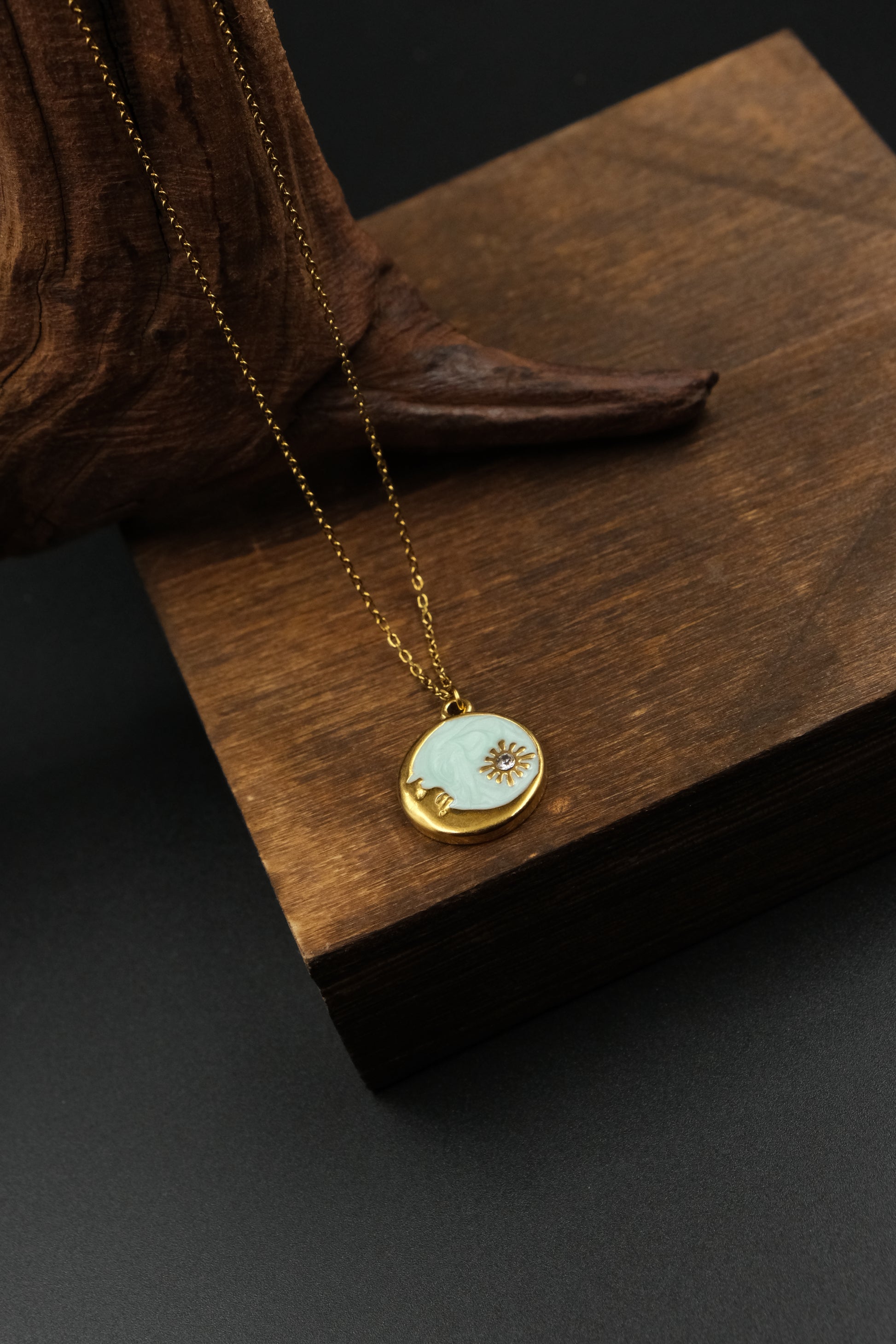 Good luck necklace with a Shoushan Stone pendant on a wooden surface