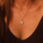 Blessings & Clarity – Shoushan Stone Good Luck Necklace with a pendant worn by a person in a black top.
