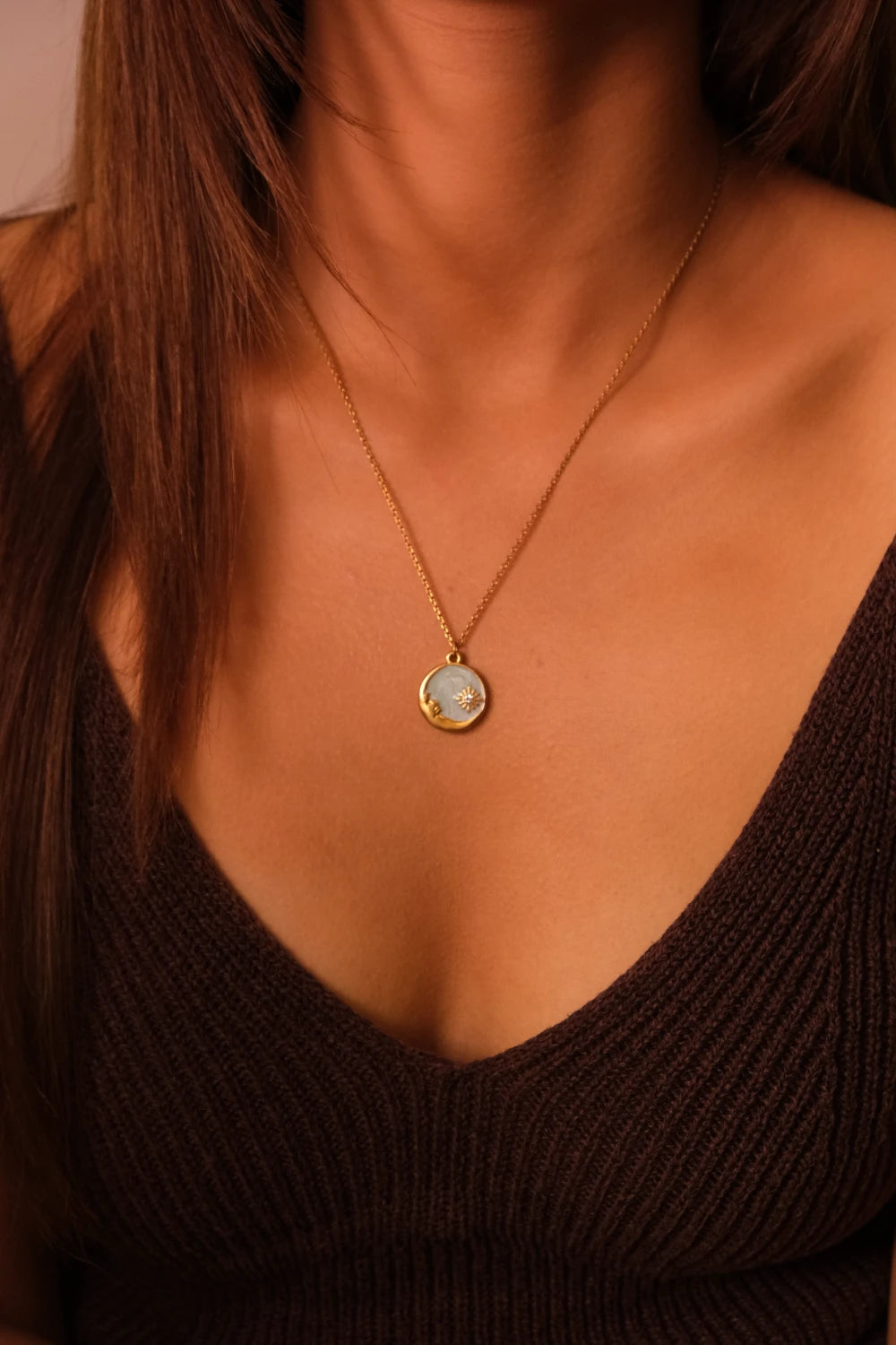 Blessings & Clarity – Shoushan Stone Good Luck Necklace with a pendant worn by a person in a black top.