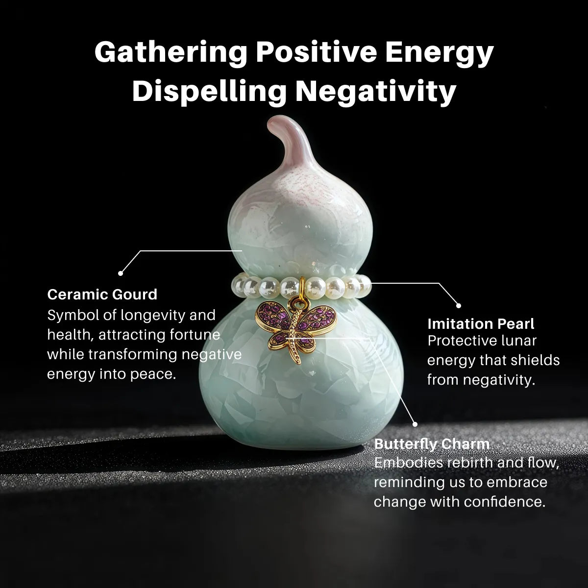 Ceramic gourd with imitation pearl and butterfly charm on a black background