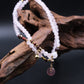 Beaded bracelet with pink crystal/Rose Quartz on a dark background