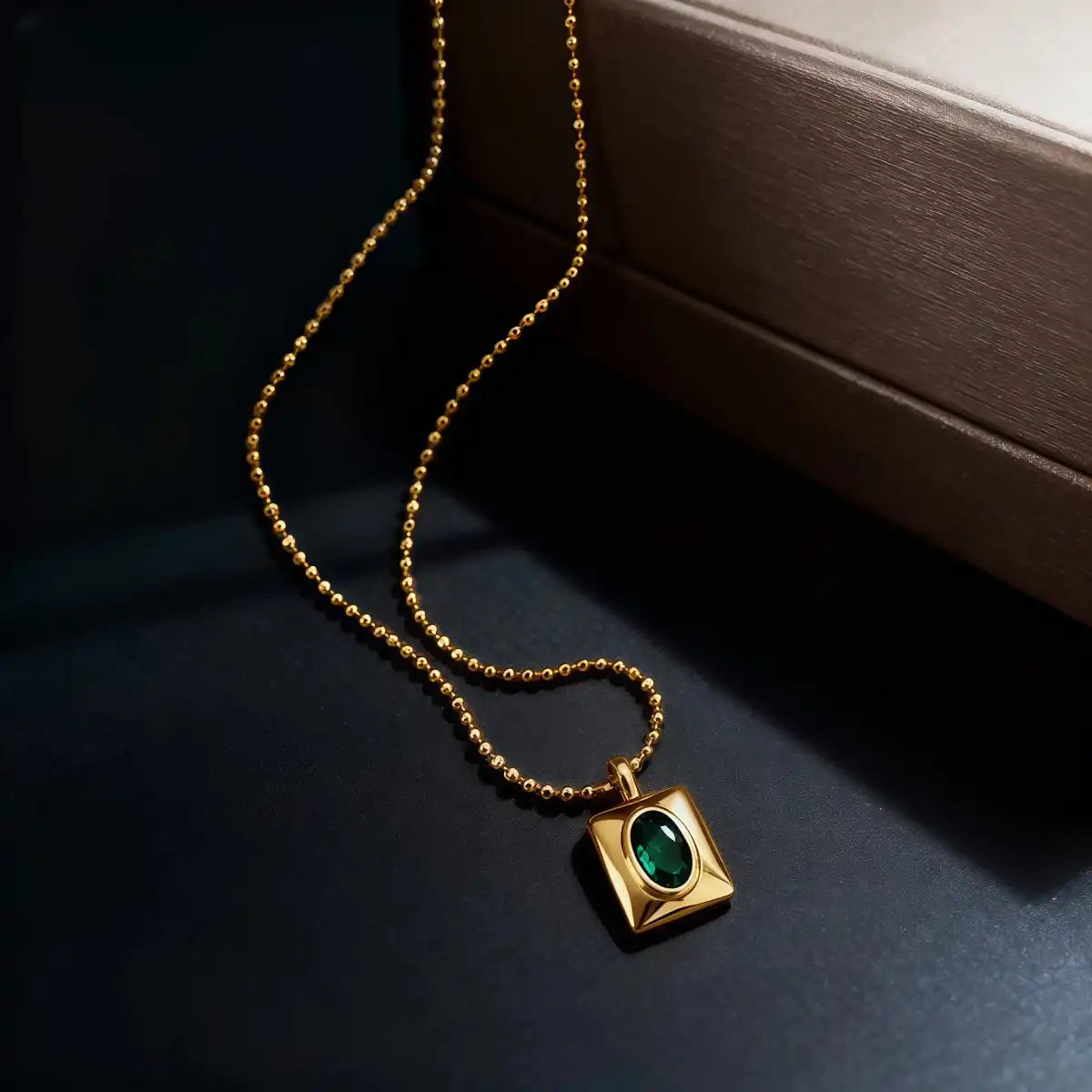 Emerald CZ heart pendant necklace displayed clearly on a clean background.