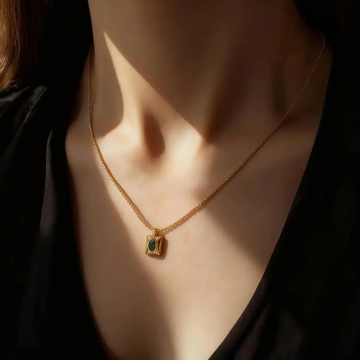 Model wearing the emerald CZ heart necklace, showing size and elegant fit.