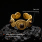 Infographic pointing to the "Tiger's Eye" stones and "Circle Links Gold-Plated Metal Alloy" on the ring.