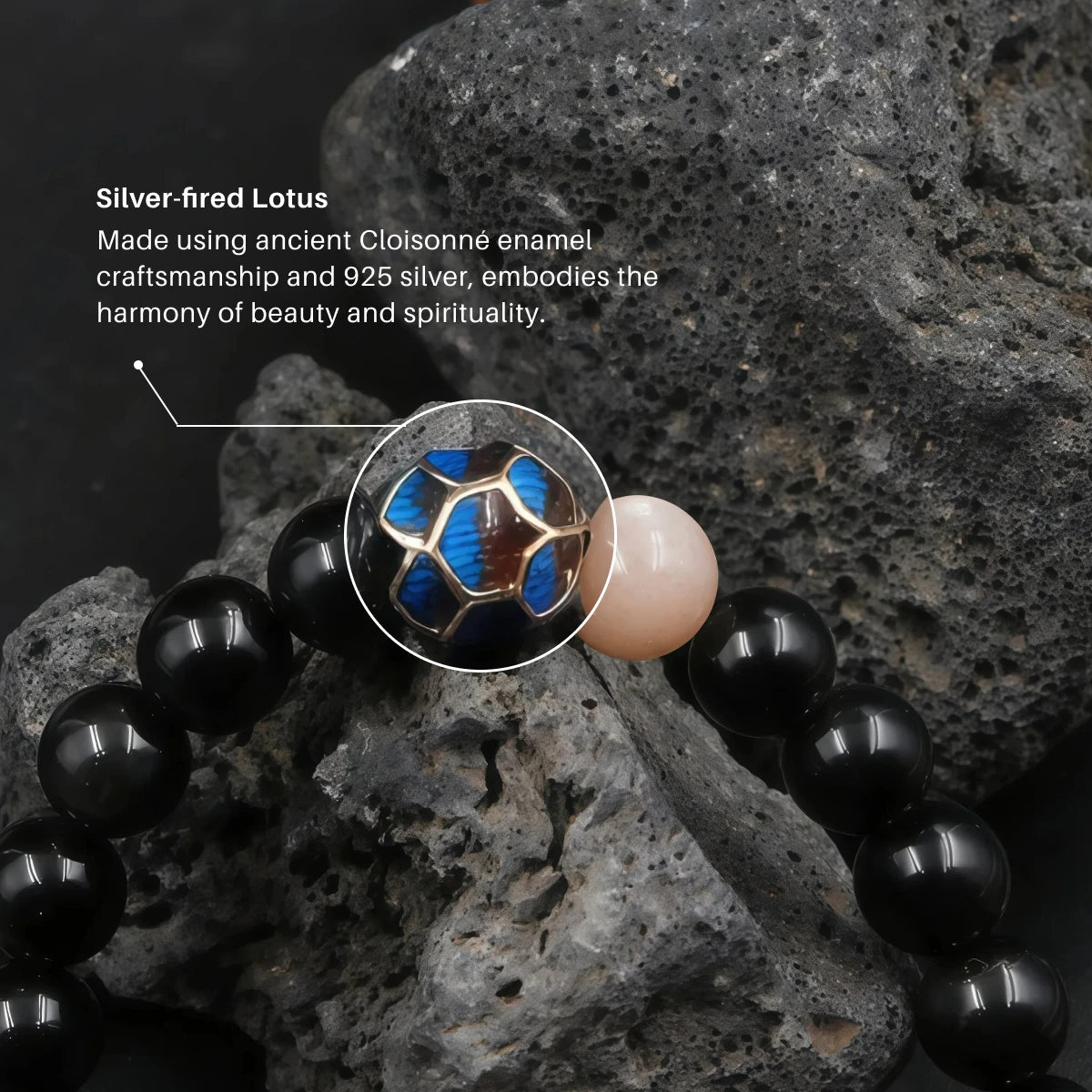 Macro shot focusing on the blue cloisonné enamel bead and the smooth pink sunstone bead.