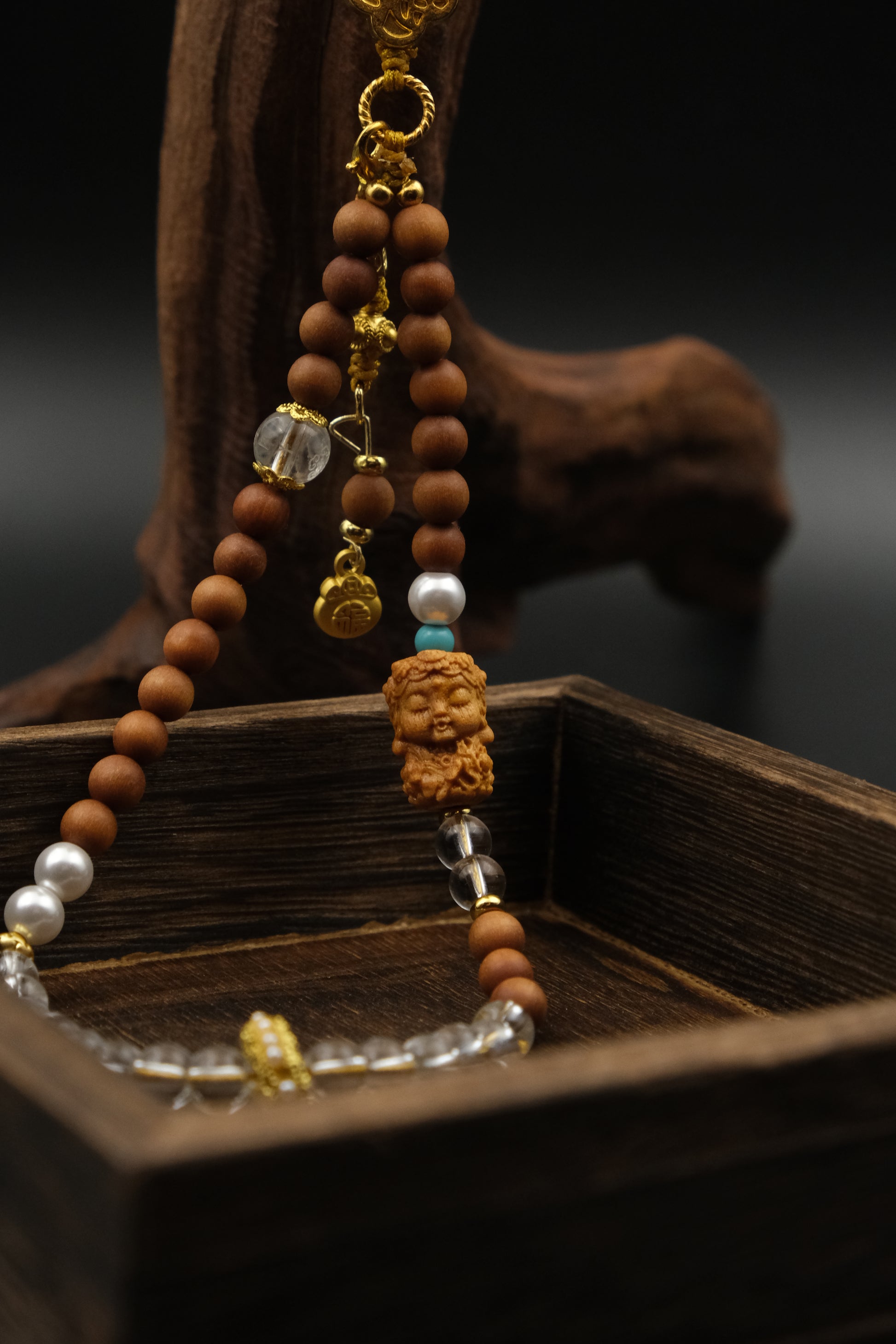 Spiritual Protection, Calmness & Positive Energy Meditation Phone Strap & Car Charm with wooden beads and decorative elements on a dark background