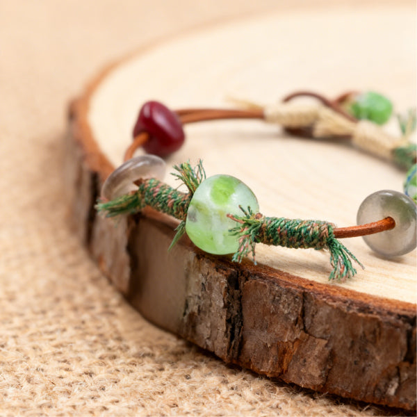 Handmade Tibetan bracelet with colorful glass beads and braided cord
