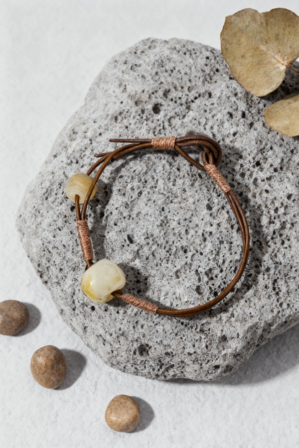 Bracelet with natural beads on a stone surface
