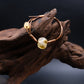 Unique Sun Spirit bracelet with ancient liuli beads for grounding and inner clarity, displayed on driftwood.