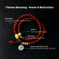 Tibetan blessing bracelet with colored beads and peace coin on a dark background