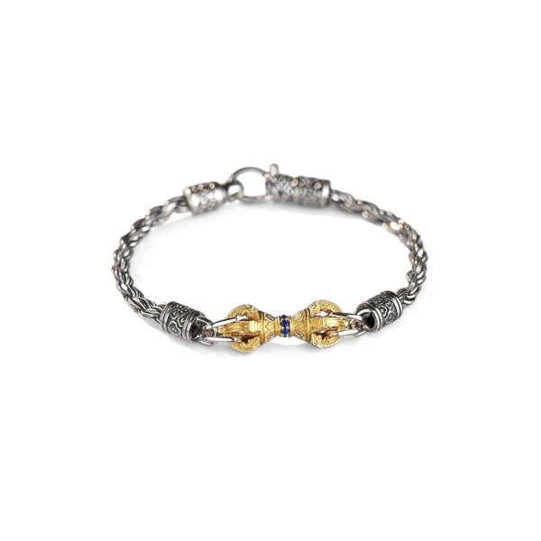 Bracelet with gold and silver design on a white background