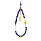 Necklace with blue Lapis Lazuli beads, yellow accents, and a gold pendant on a white background