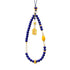 Necklace with blue Lapis Lazuli beads, yellow accents, and a gold pendant on a white background