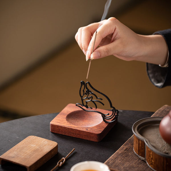 Serenity & Blessings Buddhist Mudra Incense Holder with metal hand in sacred mudra on wooden base, spiritual incense burner for meditation, tea ceremony, and home decor in warm tranquil tones.