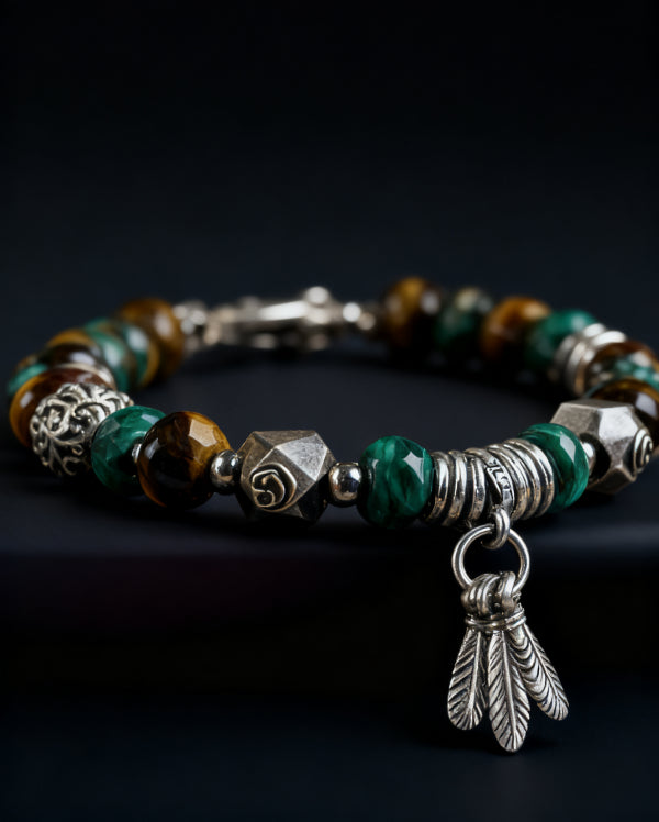 Bracelet with green beads and silver accents on a dark background