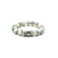A Tibetan Bracelet featuring beads in soft shades of light blue and white, creating a soothing visual effect. Among these beads, there's a small golden bead inscribed with text, likely part of the Six - Word Mantra. Additionally, a silver - toned bead is interspersed among the others. 