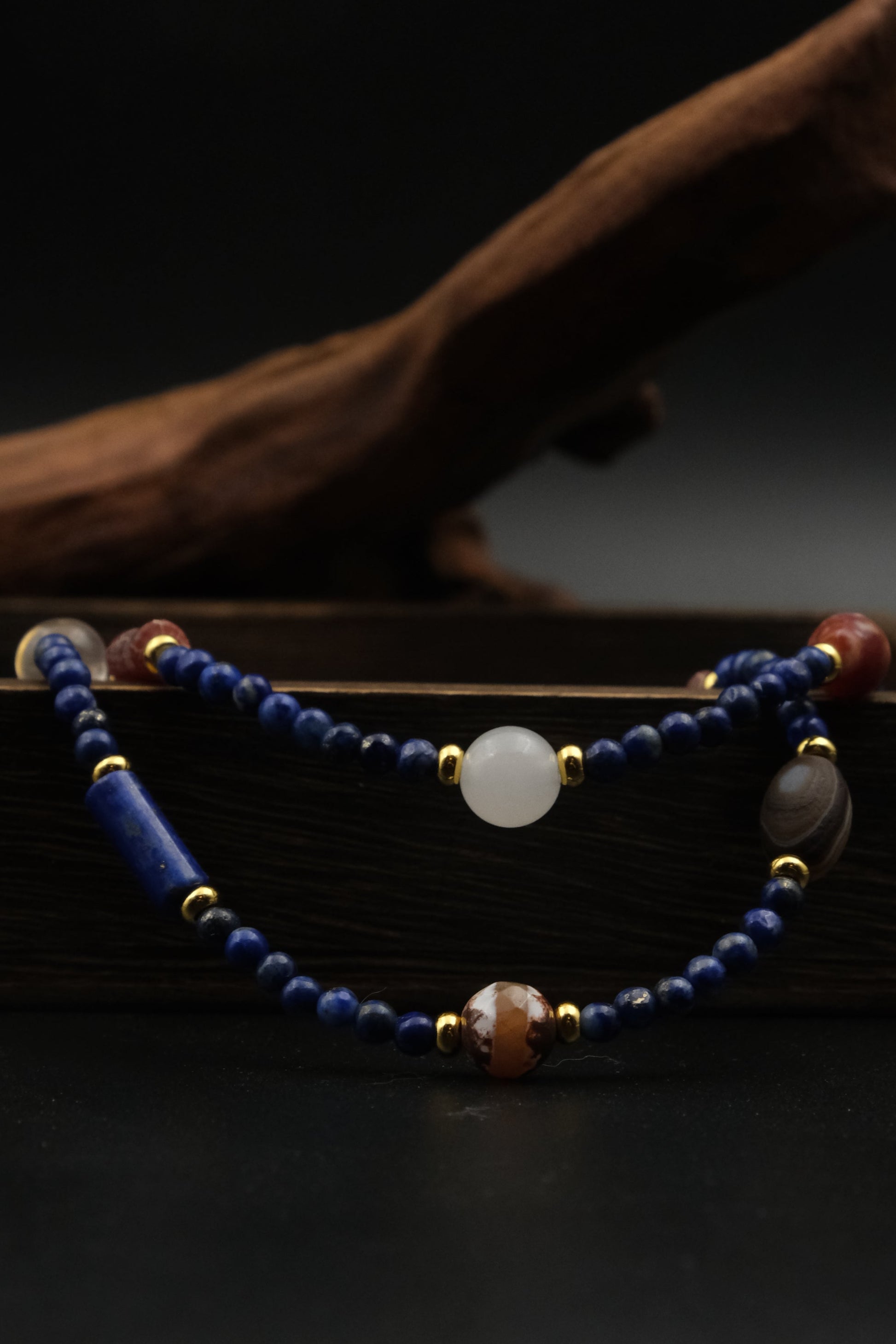 Inspired by Tibetan metaphysical traditions, this Lapis Lazuli Mala / Triple-Wrap Bracelet is a talisman of protection, purification, and healing. Each natural bead is carefully chosen to support spiritual clarity, emotional balance, and overall well-being.
Lapis Lazuli: Connected to the Third Eye chakra, it offers protection, mental clarity, and spiritual insight.
Agate: Grounds and stabilizes energy, shielding against emotional and physical stress.
White Crystal: Clears negative energy and supports energe
