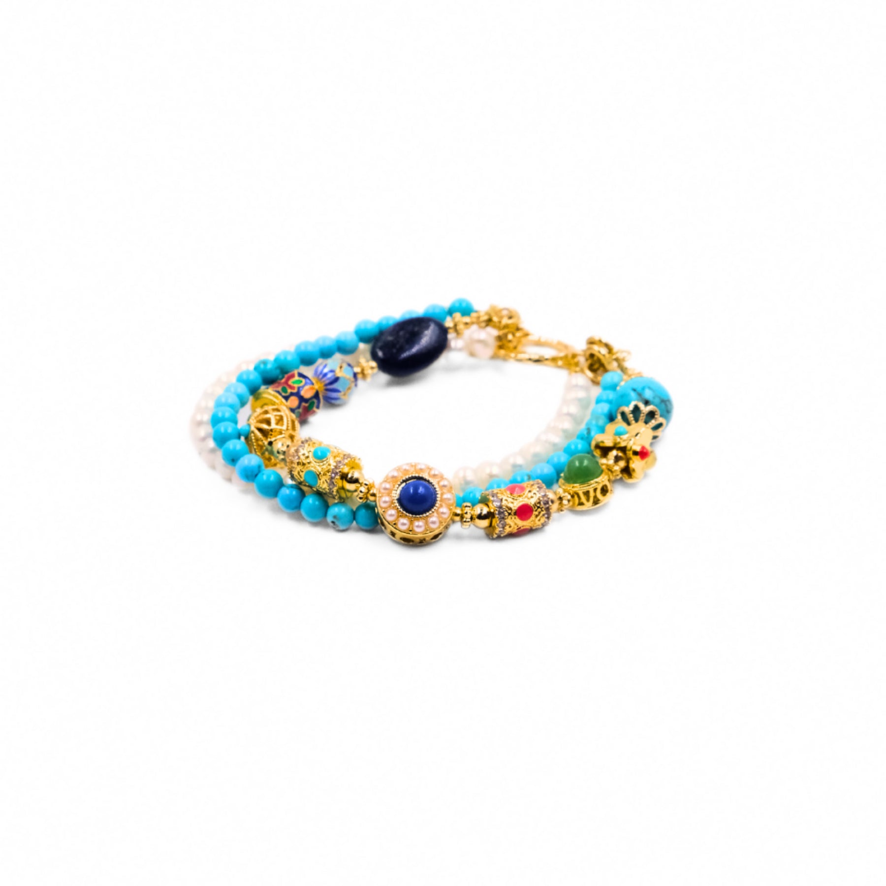 A Tibetan Energy Healing Bracelet featuring multiple strands. The strands include light - colored pearls, vibrant turquoise beads, and intricately designed cloisonné beads with colorful patterns. Additionally, there are gold - toned decorative elements, along with beads of other colors like dark blue, green, and red, adorned with gold accents.