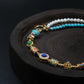 Close - up of Tibetan Energy Healing Bracelet: Featuring pearls, turquoise, and cloisonné elements, designed for emotional balance, protection, and elemental alignment.