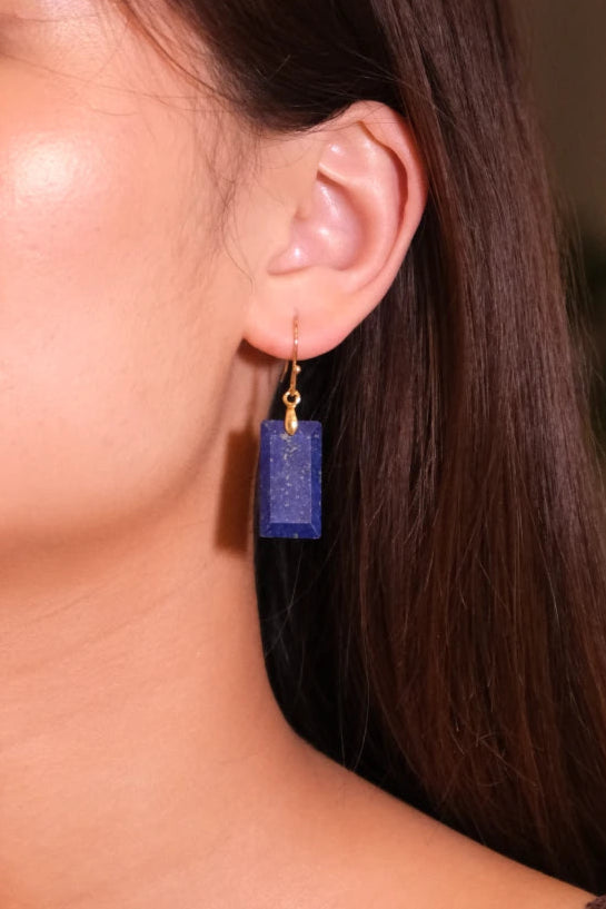 Close-up of a woman wearing a Tibetan Feng Shui Crystal Earrings – Lapis Lazuli for Protection, Purification & Well-Being
