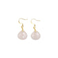 Pair of Tibetan Feng Shui Drop Earrings with Rose Quartz on a white background