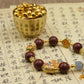 Gold cup with small round objects on a piece of paper with Chinese text,Tibetan Five Elements Aromatherapy Bracelet – Handcrafted Incense Beads with Ancient Tibetan Craft for Blessings, Energy Cleansing & Inner Balance