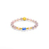A Tibetan Five Elements Flow Bracelet featuring soft - pink beads interspersed with golden accents. A prominent blue agate bead is centered among them, flanked by unique incense - glass beads. A golden plum blossom charm adds an elegant touch. This bracelet is believed to aid in emotional healing, attract wealth, and offer spiritual protection. 