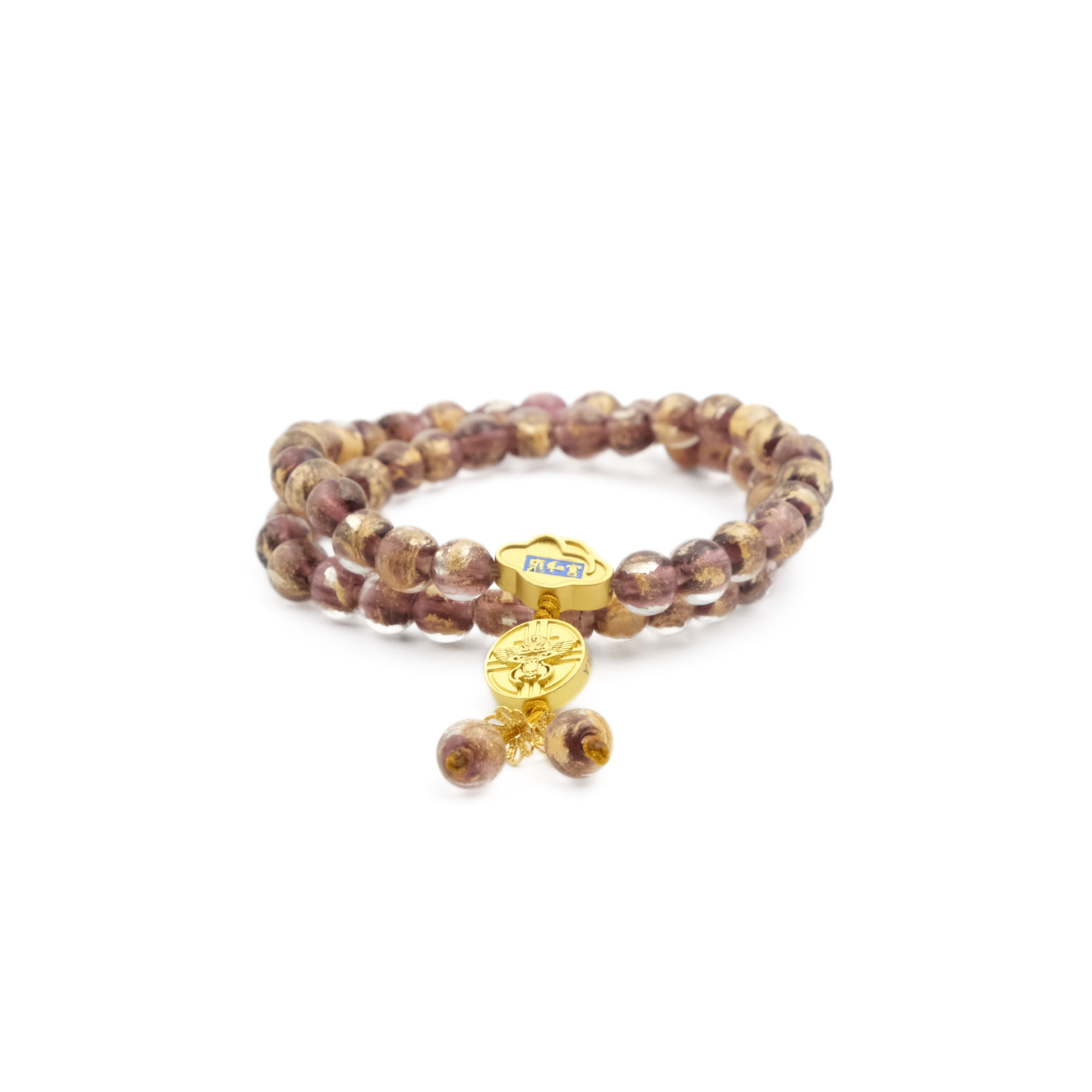 A Tibetan Five Elements Flow Bracelet with two strands of purple foil ash - glass beads. It is embellished with a golden temple charm, which has a small decorative element featuring blue inlays above it. Hanging from the charm are two purple beads. This bracelet is believed to bring clarity, calmness, and spiritual insight. 