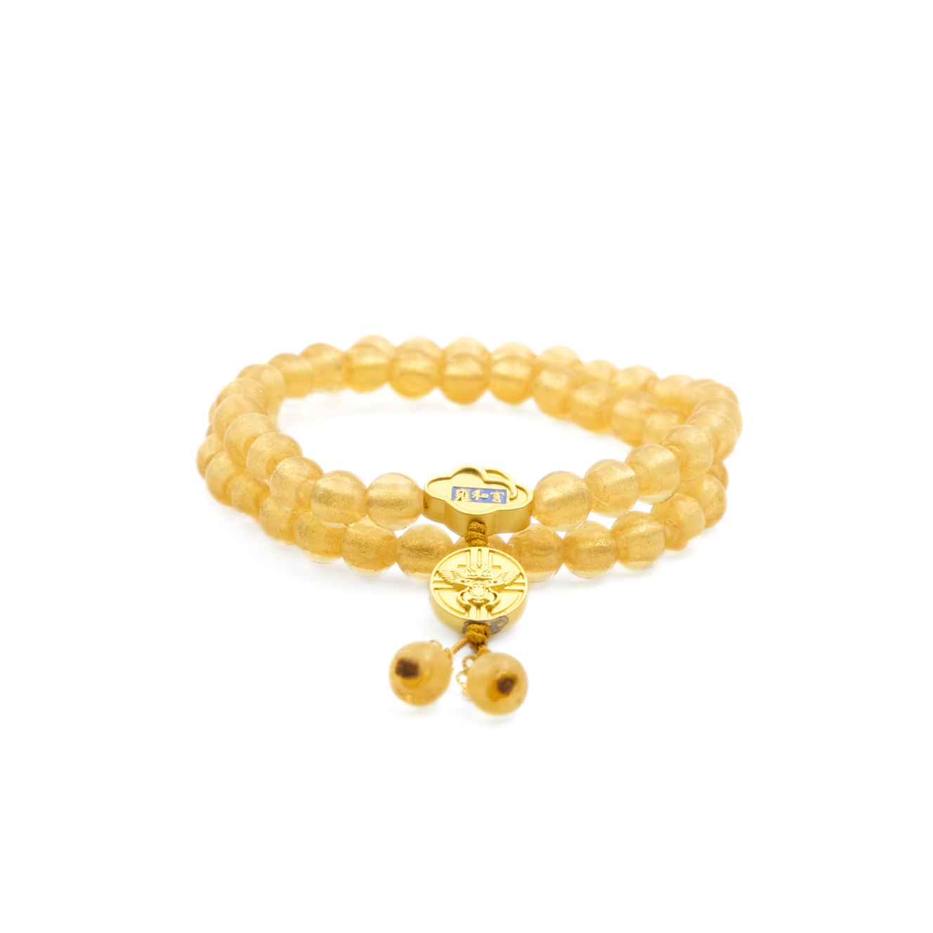 A Tibetan Five Elements Flow Bracelet composed of two layers of translucent yellow foil ash - glass beads. Adorned with a golden temple charm and a small decorative piece above it with blue inlays. This bracelet is believed to bring clarity, prosperity, and grounded wisdom. 