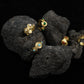 Tibetan Five Elements Ring for Emotional Healing & Growth on a black stone surface