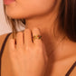 Close-up of a woman wearing a Tibetan Red Agate Five Elements Ring on a neutral background